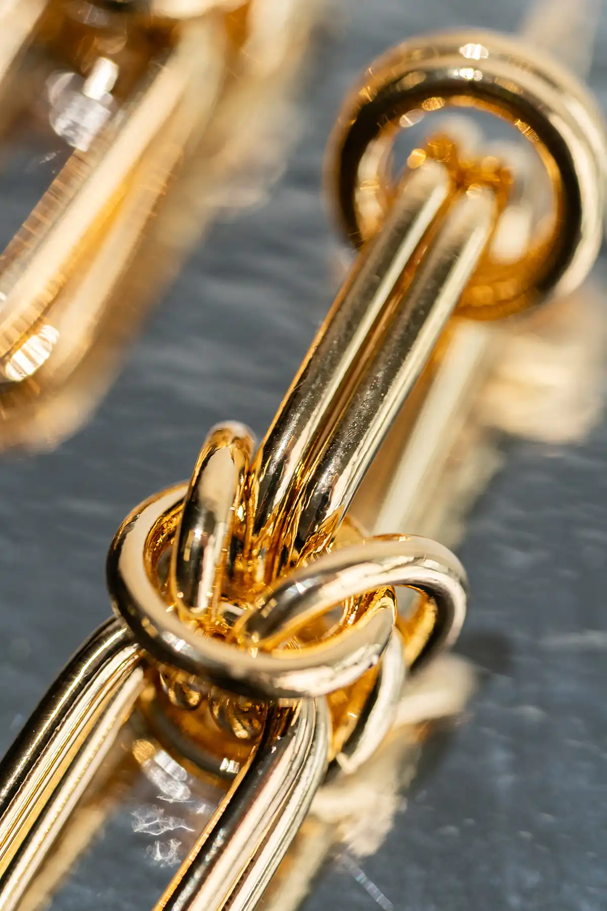 Gouden Earring Knotted Link (Brass)lott-theme.productDescriptionPage.SEO.byTheBrand