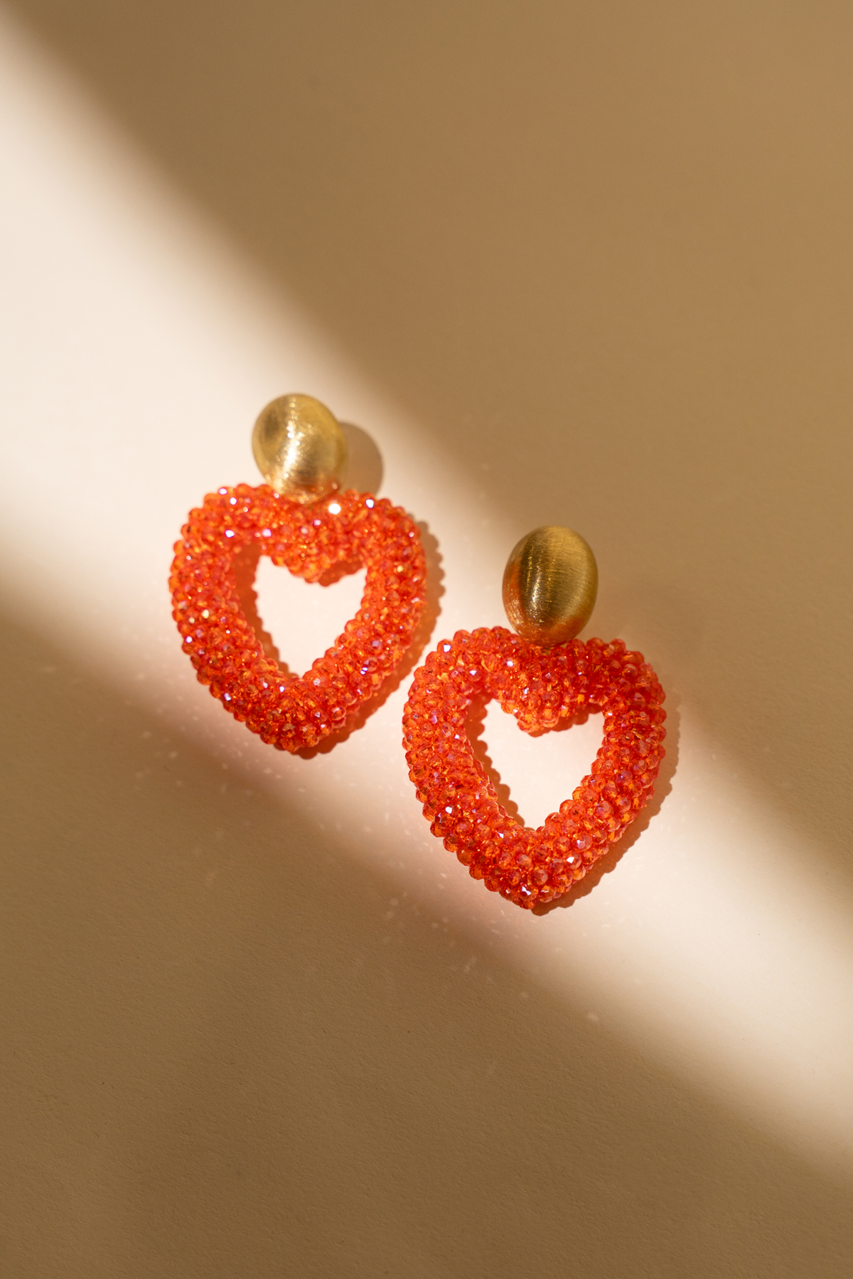 Herz aus Orange Limitierte Ohrringelott-theme.productDescriptionPage.SEO.byTheBrand