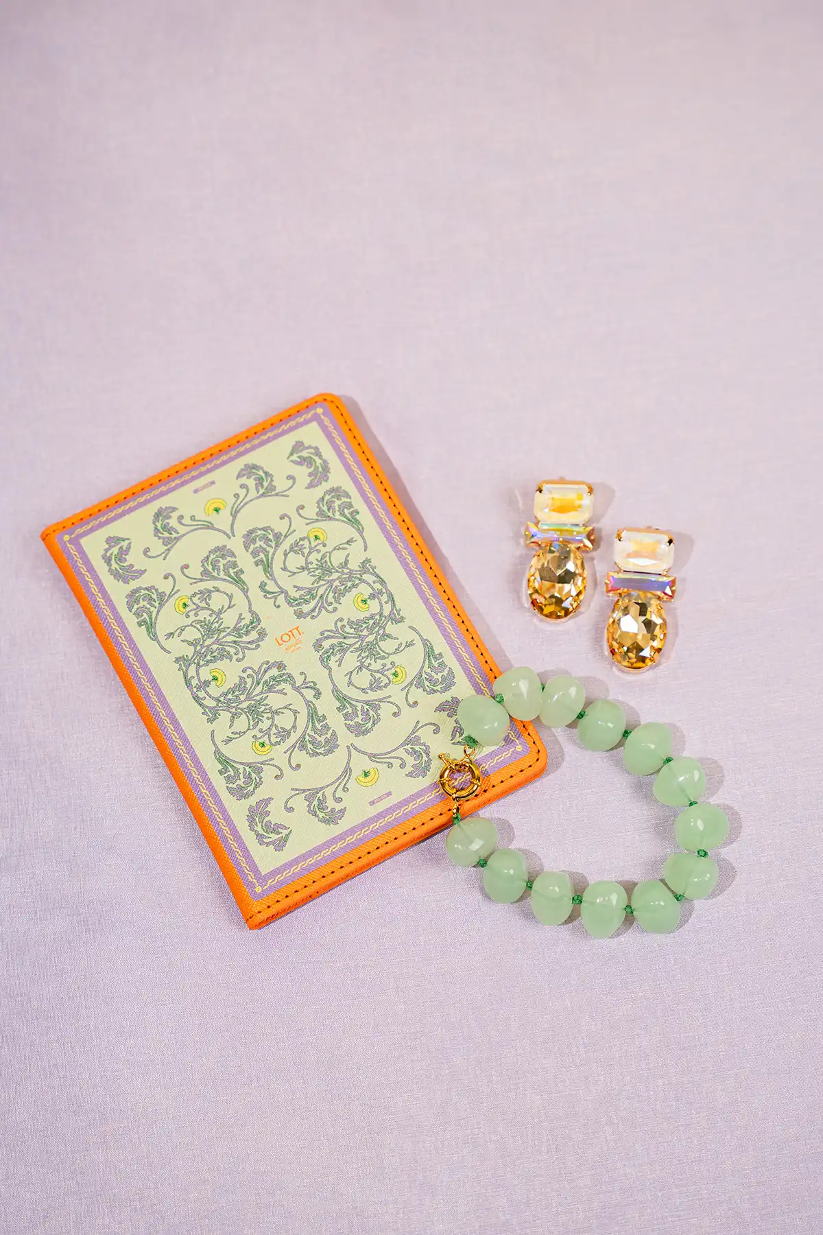 Lila/Pastel Green/Orange Passport Hoeslott-theme.productDescriptionPage.SEO.byTheBrand