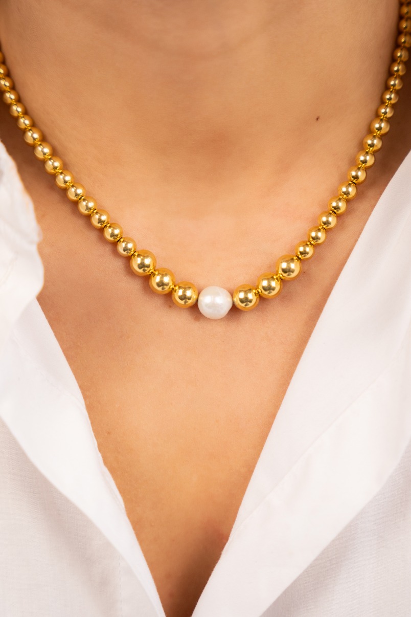 Gold color necklace with a cannonball with pearl Lilaclott-theme.productDescriptionPage.SEO.byTheBrand